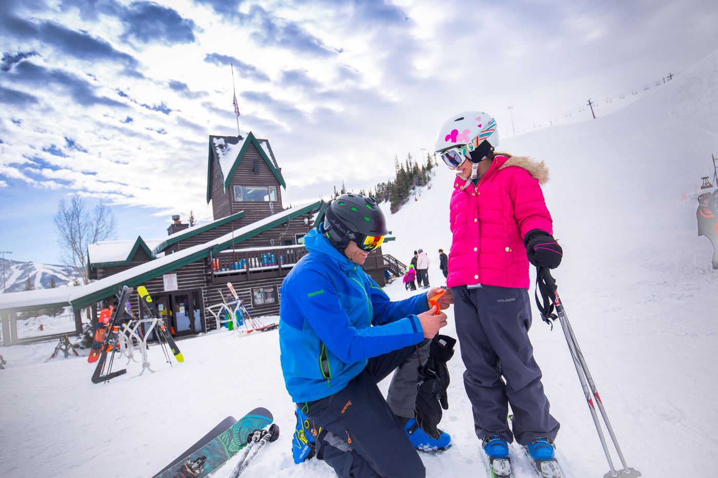 Family putting on ticket at Lodge