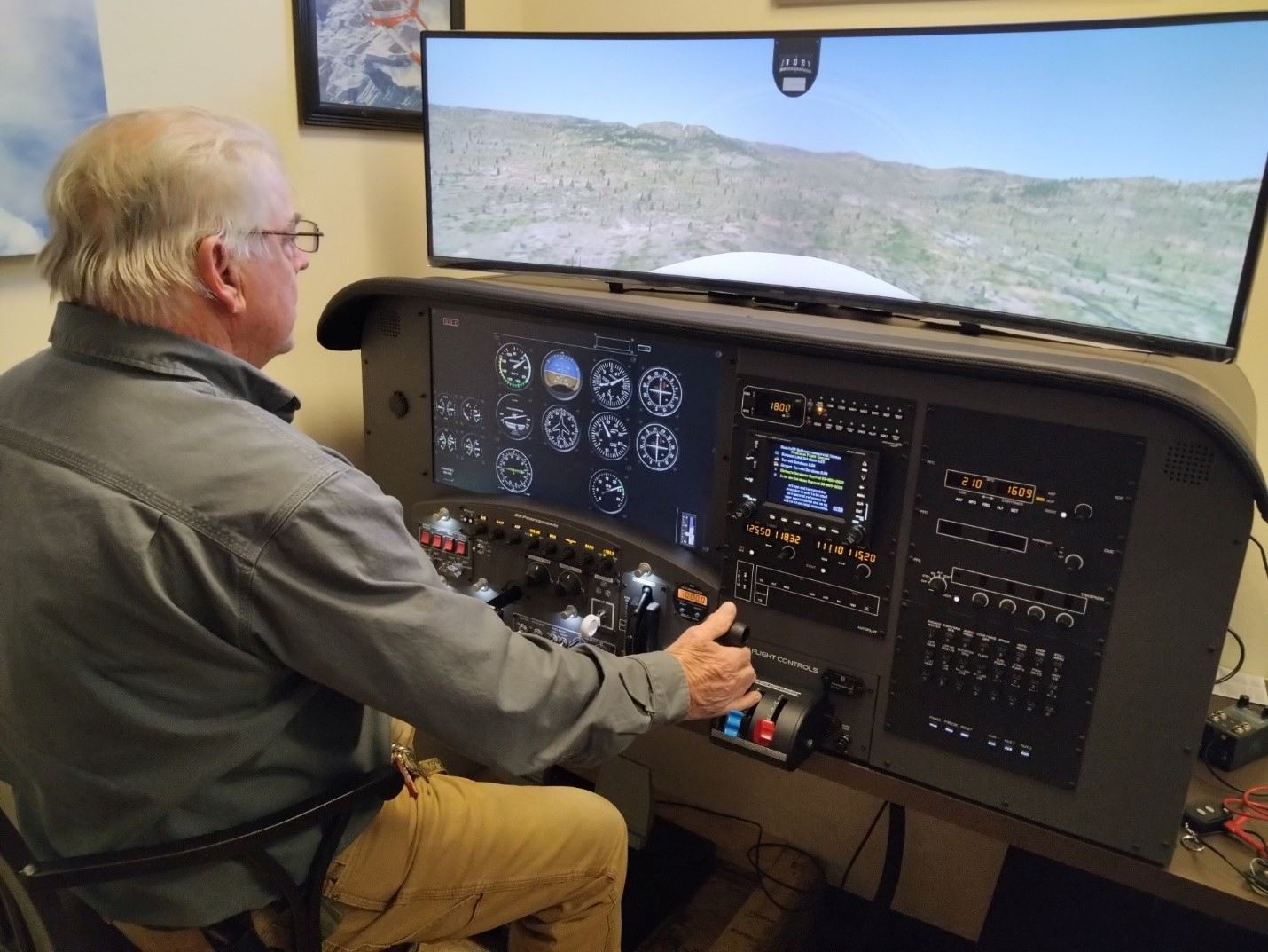 Man using the flight simulator at the airport